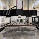 9.9成新紐威4米龍門。工作臺(tái)2米4米，門寬2.8米，Y軸行程3.2米，.
